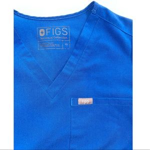Used Figs one-pocket scrub top in royal blue